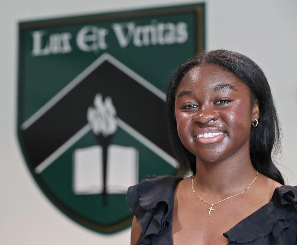 Star student Nana Kyei, 18, a Western Reserve Academy graduate, poses by the school's coat of arms. Lux et Veritas, or "light and truth," is a guiding principle at the school.