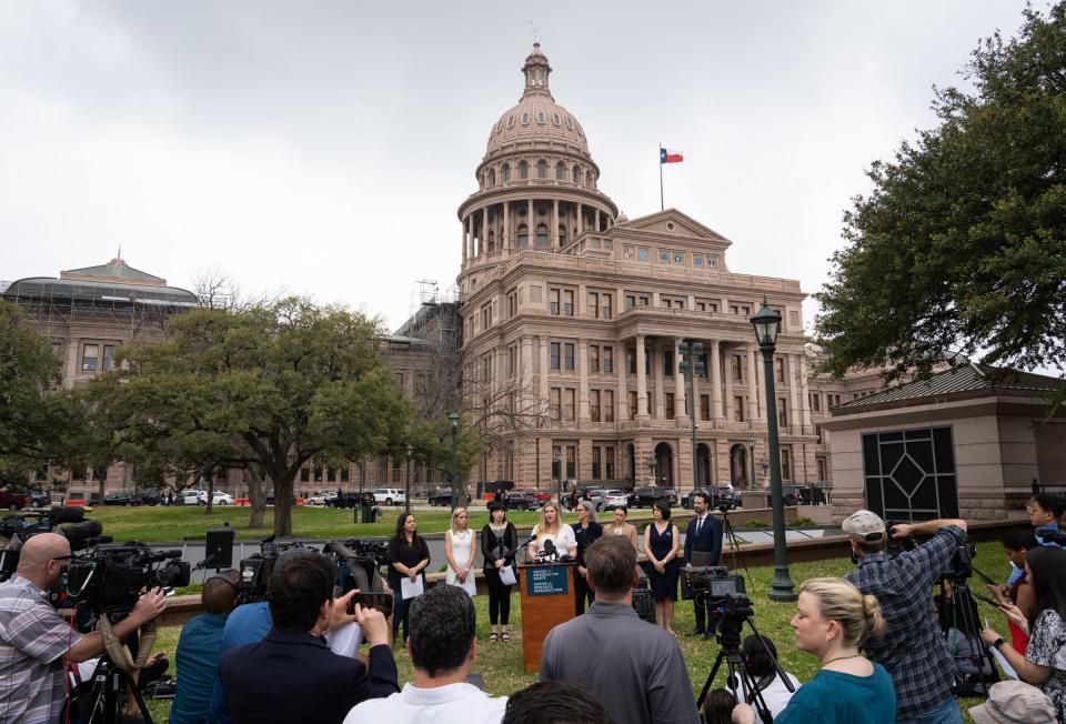 Lauren Miller, one of five plaintiffs in Zurawski v. State of Texas, speaks in front of the Capitol in March as the lawsuit is announced.