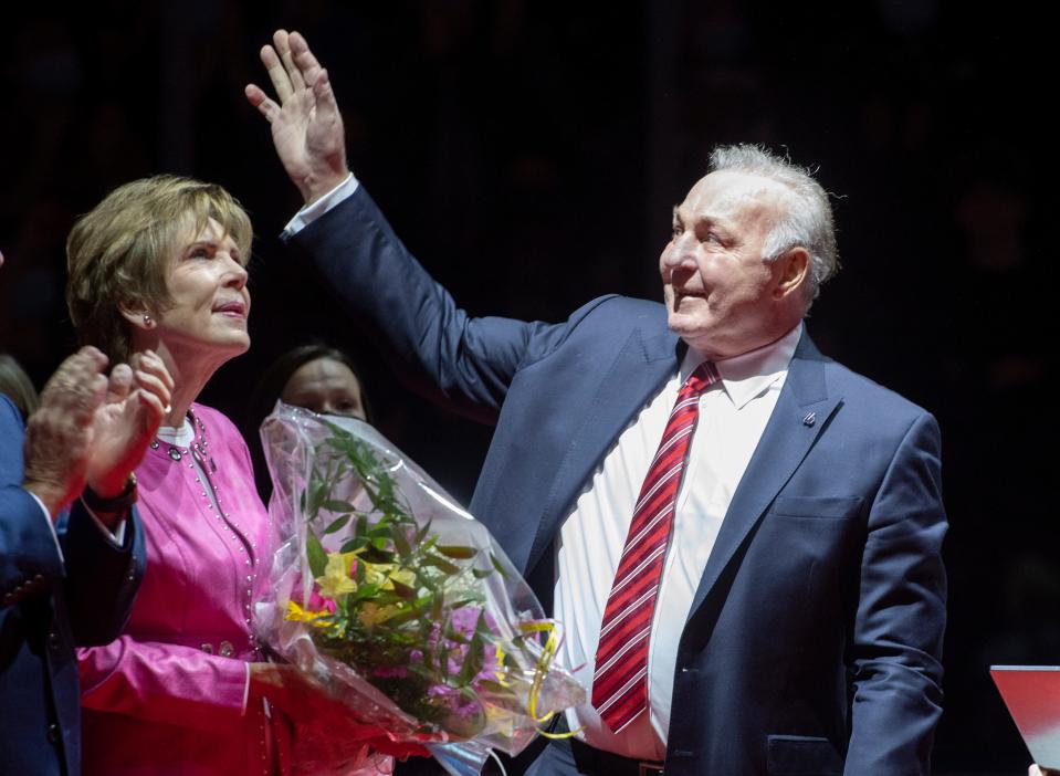 NHL hockey legend Guy Lafleur waves to fans as his wife Lise looks on during a ceremony to honor him, Thursday, October 28, 2021, at the Videotron Centre in Quebec City. Montreal Canadiens legend Guy Lafleur has died at age 70. (Jacques Boissinot/The Canadian Press via AP)