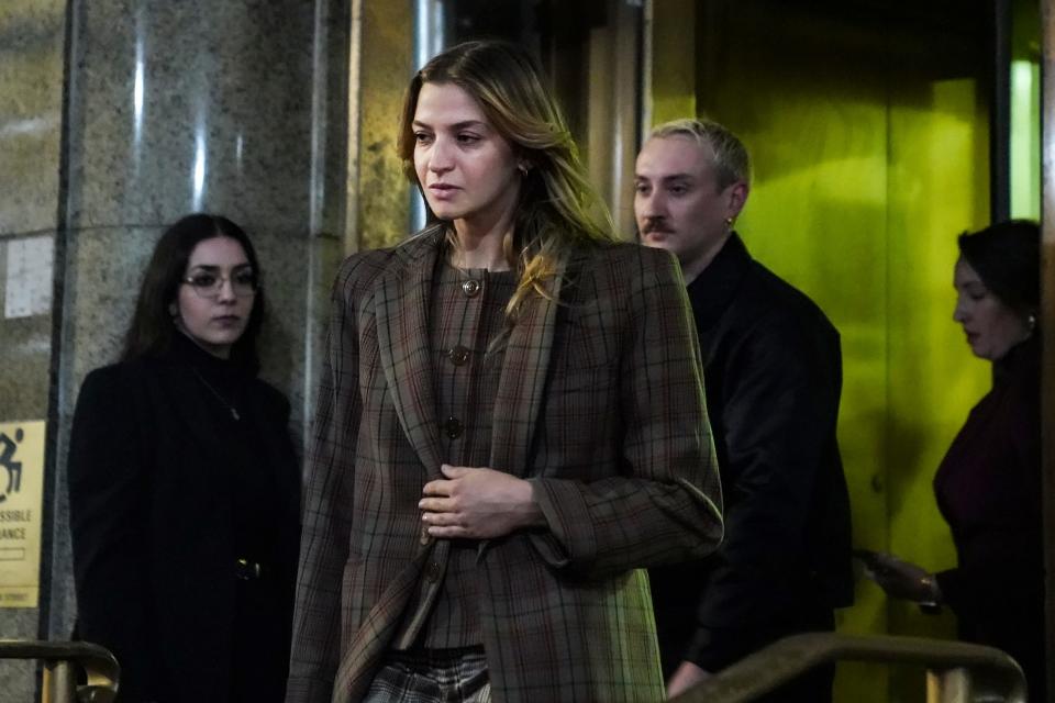 Grace Jabbari, second from left, the accuser in the assault case against Jonathan Majors, leaves court after giving testimony, Tuesday, Dec. 5, 2023, in New York. (AP Photo/Bebeto Matthews)