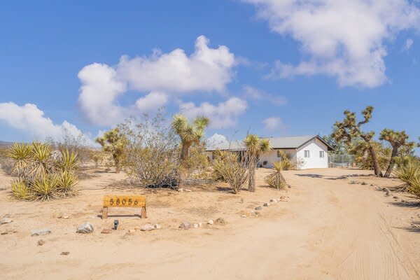 The newly remodeled home sits on a spacious desert lot, conveniently located just a short drive from the area's most popular destinations, including Joshua Tree National Park.