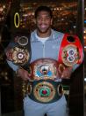 FILE PHOTO: Anthony Joshua poses with the IBF, WBA, WBO & IBO World Heavyweight belts after winning his title fight against Andy Ruiz Jr