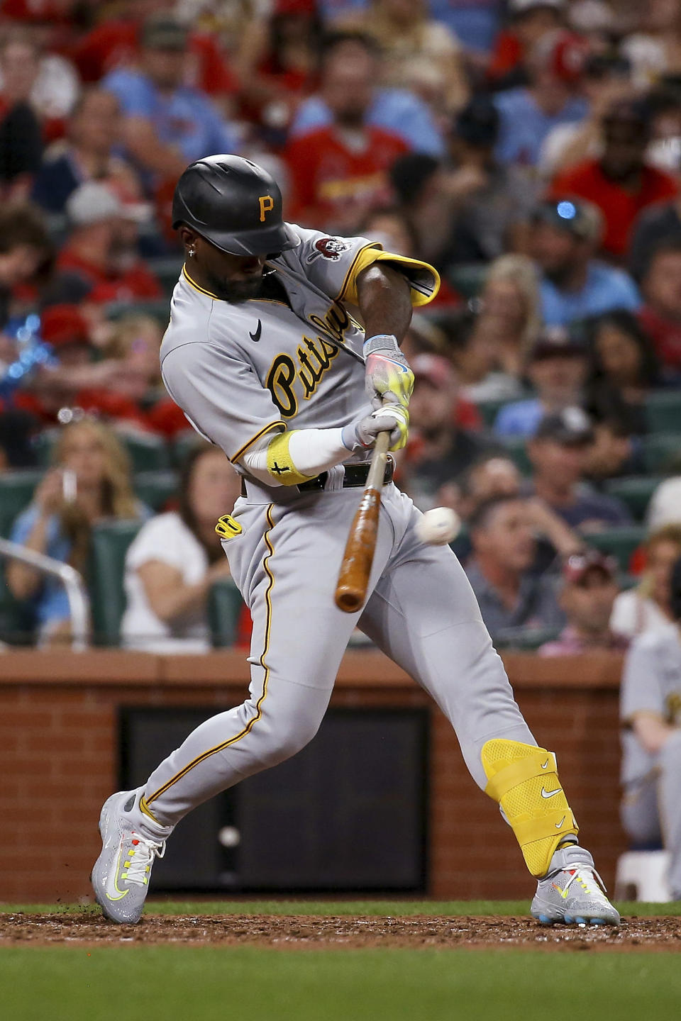 Pittsburgh Pirates' Andrew McCutchen hits a sacrifice fly during the seventh inning against the St. Louis Cardinals in a baseball game Thursday, April 13, 2023, in St. Louis. (AP Photo/Scott Kane)