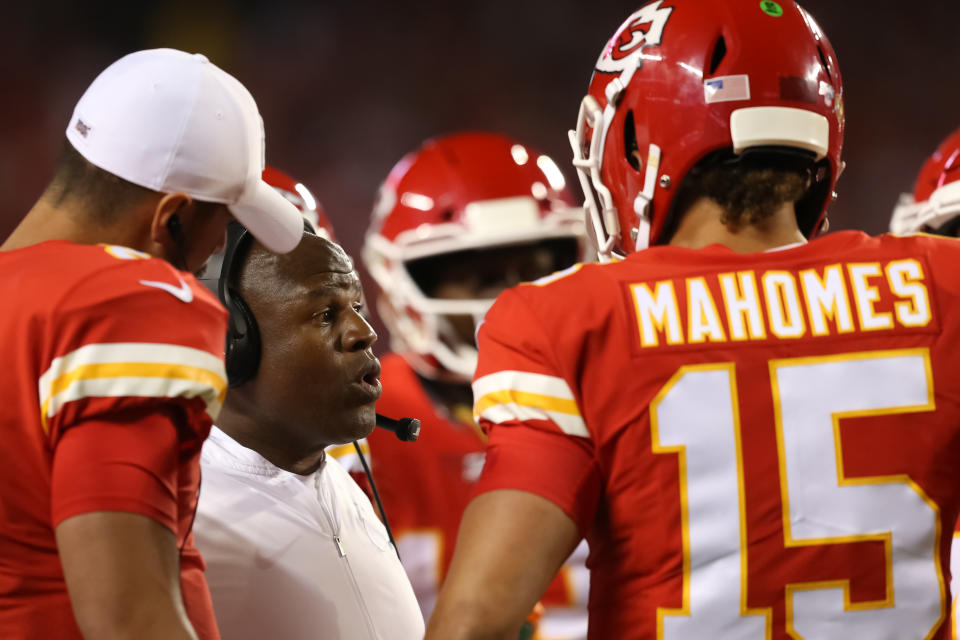 KANSAS CITY, MO - OCTOBER 06: Kansas City Chiefs offensive coordinator Eric Bieniemy in a huddle with quarterbacks Patrick Mahomes (15) and Matt Moore (8) in the second quarter of an NFL matchup between the Indianapolis Colts and Kansas City Chiefs on October 6, 2019 at Arrowhead Stadium in Kansas City, MO. (Photo by Scott Winters/Icon Sportswire via Getty Images)