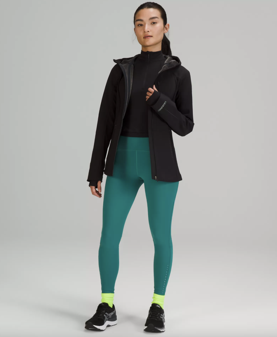 asian model in green leggings and Lululemon Cross Chill Jacket in Black (Photo via Lululemon)