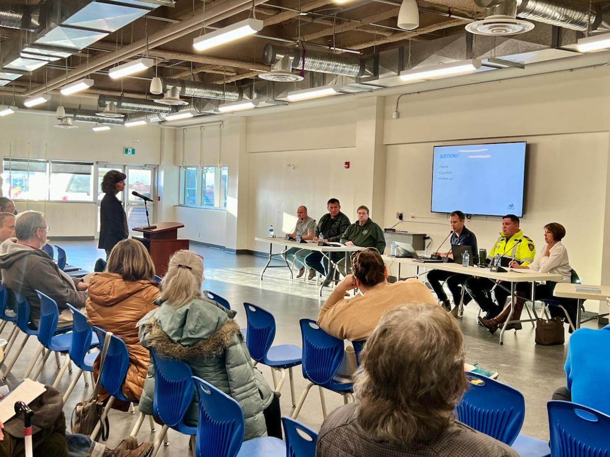 Hay River residents attend a wildfire and flood preparedness meeting on Tuesday.  (Carla Ulrich/CBC  - image credit)