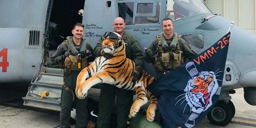 VMM-262 Marines with a large stuffed tiger.