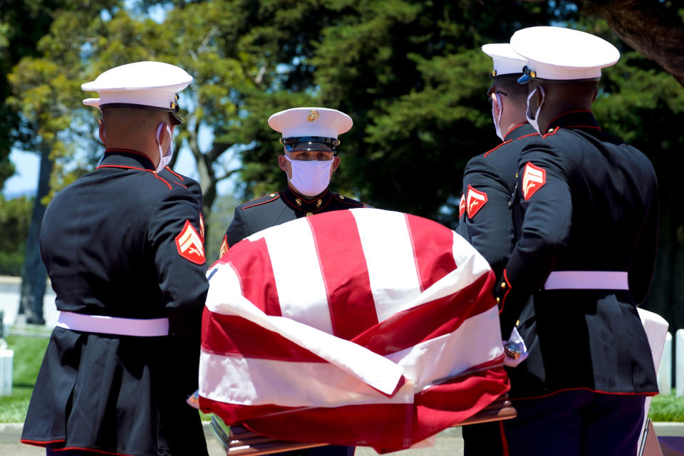 A military honor guard carries the casket of Marine Corps, Pfc. John Franklin Middleswart for a full military honors at Fort Rosecrans National Cemetery on Tuesday, June 8, 2021, in San Diego. Eighty years after he died in the attack on Pearl Harbor and just months after his remains were finally identified, the California Marine has been laid to rest with full military honors. (Nelvin C. Cepeda/The San Diego Union-Tribune via AP)