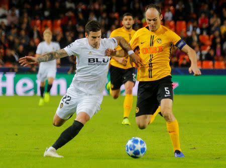 Soccer Football - Champions League - Group Stage - Group H - Valencia v Young Boys - Mestalla, Valencia, Spain - November 7, 2018 Valencia's Santi Mina in action with Young Boys' Steve von Bergen REUTERS/Heino Kalis