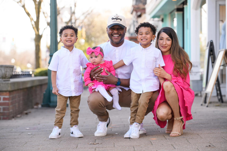 Photo of family posing on sidewalk.  (Courtesy Jonathan Avila)