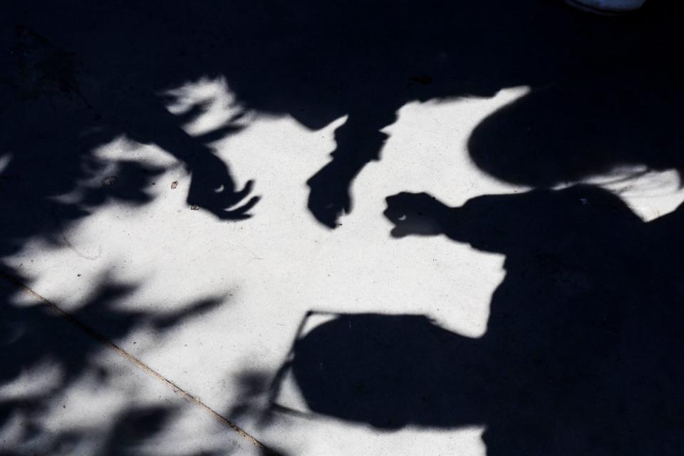 Students at the University of Sonora use their shadows to reflect the eclipse on the ground in Hermosillo, Mexico.<span class="copyright">Jesus Ballesteros—Norte Photo/Getty Images</span>
