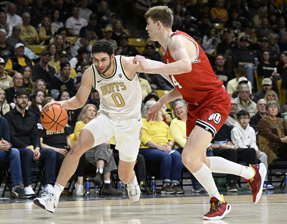 Colorado guard Like O’Brien, left, drives past Utah forward Lawson, right, Lovering in the first half of an NCAA college basketball game Saturday, Feb. 24, 2024, in Boulder, Colo. | Cliff Grassmick, Associated Press