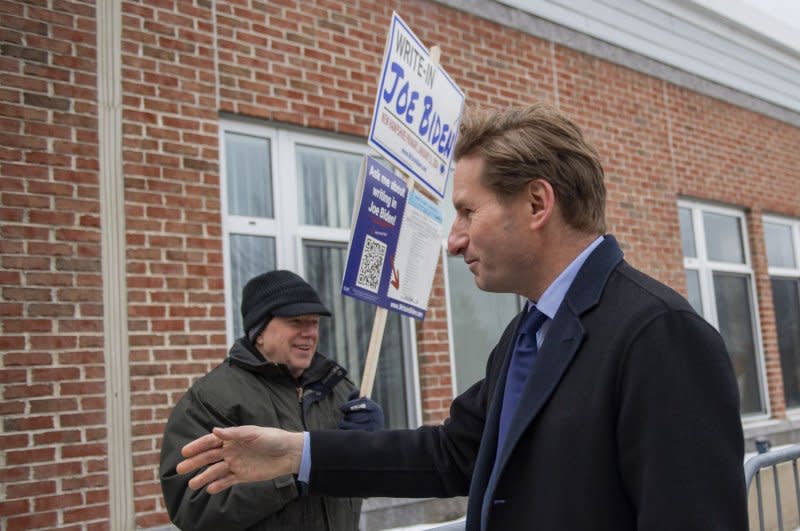 Minnesota Rep. Dean Phillips, who is seeking the Democratic presidential nomination, greets voters during the New Hampshire Primary in Windham, N.H., on Tuesday. Photo by Amanda Sabga/UPI