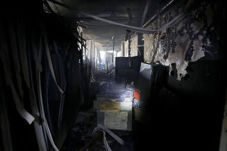 Burned debris is seen at the offices of the Housing Ministry in Maracaibo, Venezuela May 25, 2017. REUTERS/Isaac Urrutia