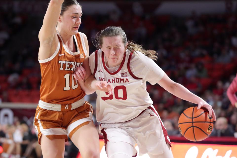 Oklahoma guard Taylor Robertson tries to get past Texas guard Shay Holle during Saturday's game. Holle got hot in the third quarter, scoring 11 points to help the Longhorns separate themselves from the Sooners. "I thought Rori (Harmon) just found me in really good spots," Holle said.