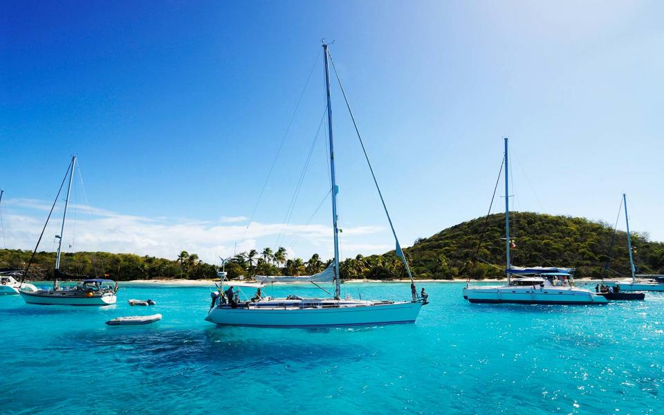 <p>St. Vincent and the Grenadines encompasses 32 islands, secluded private cays and fancy, yacht-filled harbors. It’s known as a major sailing destination and offers some of the best sands in the Caribbean. Stay in the luxury beach-front resort, the <a rel="nofollow noopener" href="http://www.pinksandsclub.com/" target="_blank" data-ylk="slk:Pink Sands Club;elm:context_link;itc:0;sec:content-canvas" class="link ">Pink Sands Club</a> on Canouan Island, the isle of wild tortoises, and take one of the hotel’s golf-carts to explore the sprawling 1,200-acre resort. Later you can head up to Mount Royal and take in the panoramic views of the Caribbean waters, Mustique, Bequia and Tobago Cays.</p>