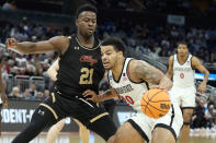 San Diego State guard Matt Bradley (20) gets around Charleston guard Jaylon Scott (21) during the first half of an first-round college basketball game in the NCAA Tournament Thursday, March 16, 2023, in Orlando, Fla. (AP Photo/Chris O'Meara)