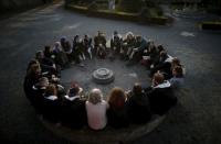 Participants listen to instructions as they attend a workshop before the role play event at Czocha Castle in Sucha, west southern Poland April 9, 2015. REUTERS/Kacper Pempel