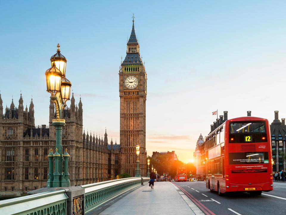 London Big Ben and traffic on Westminster Bridge - stock photo