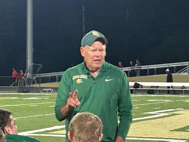 Jackson Lumen Christi head football coach Herb Brogan addresses his team after he picked up the 400th win of his storied career with a 35-7 victory over Dearborn Divine Child on Sept. 22, 2023 at Jackson Lumen Christi High School.
