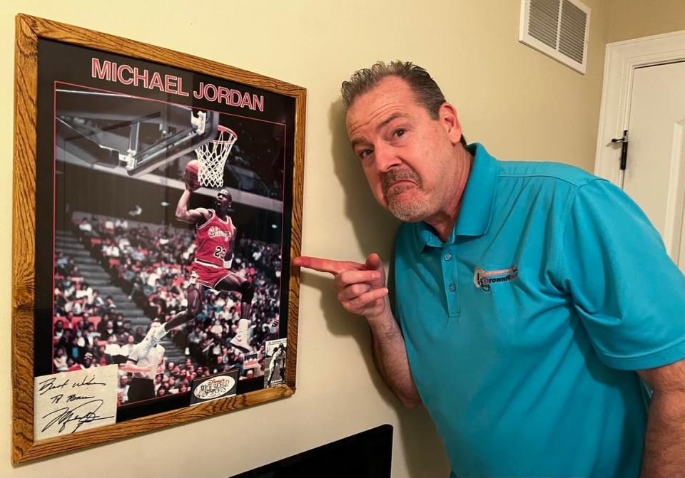 Brian Kelly, shown in his home radio studio in Jackson Township, points to a poster of Michael Jordan. Kelly, who now broadcasts on the CTown Rocks online radio station, said the basketball icon was among his all-time favorite celebrities.