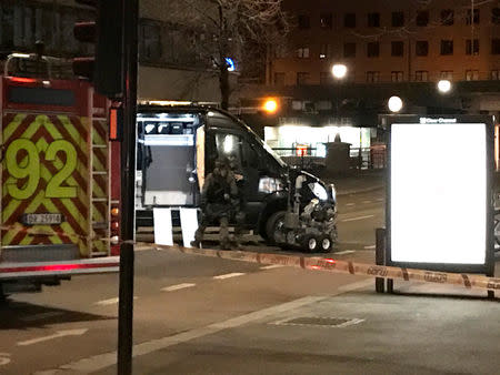 Members of Oslo police bomb squad work at the scene the after the discovery of a "bomb-like device", in Oslo, Norway April 8, 2017. REUTERS/Ole Petter Skonnord