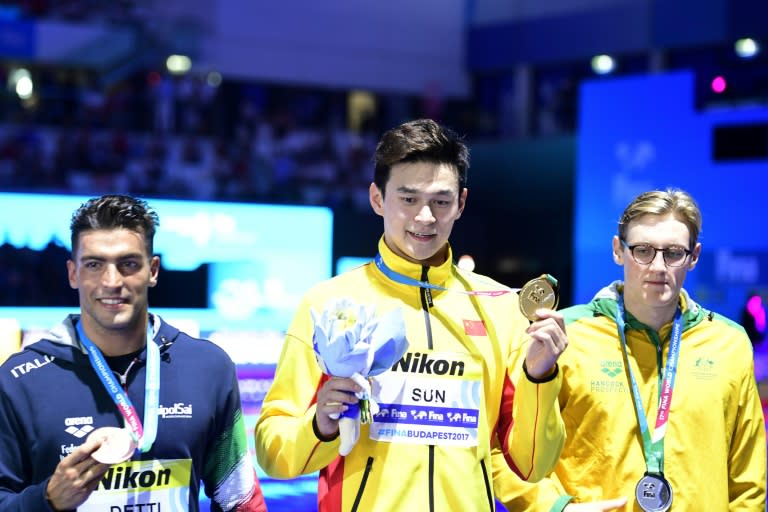 From L: Italy's Gabriele Detti, China's Sun Yang and Australia's Mack Horton celebrate on the podium of the men's 400m freestyle final in Budapest, on July 23, 2017