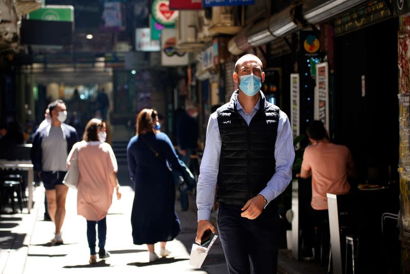 People walk down a city laneway after coronavirus disease restrictions were eased in Melbourne