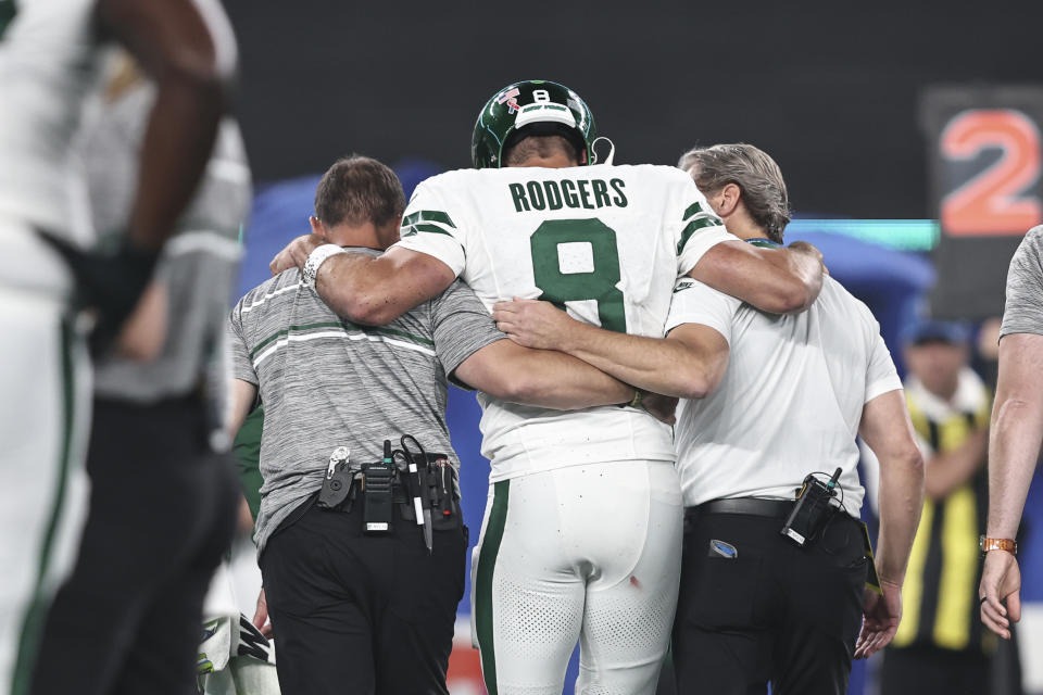 The ominous injury of Aaron Rodgers in his New York Jets debut followed by the team's thrilling overtime victory made for a locker room of mixed emotions on Monday night. (Michael Owens/Getty Images)