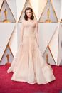 <p>Allison Williams turns heads in a gorgeous beaded champagne gown designed by Armani Privé Couture.</p>