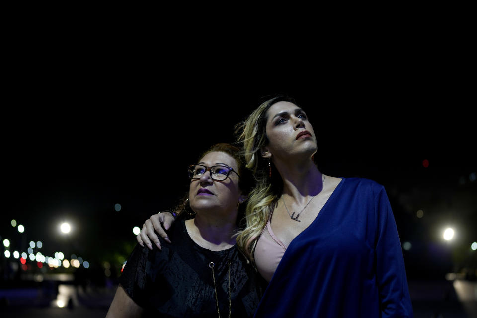 Elena Ramírez of Paraguay and her trans daughter Fabu Olmedo, pose for a picture during an interview with The Associated Press, in Buenos Aires Argentina, Thursday, Nov. 3, 2022. Ramírez says she had a difficult time accepting her daughter’s decision to come out as a trans woman until she talked to other mothers who had gone through similar experiences. (AP Photo/Natacha Pisarenko)