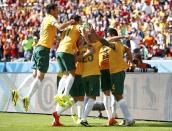 Australia's Tim Cahill (R) celebrates his goal against the Netherlands with his teammates during their 2014 World Cup Group B soccer match at the Beira Rio stadium in Porto Alegre June 18, 2014. REUTERS/Darren Staples (BRAZIL - Tags: SOCCER SPORT WORLD CUP)