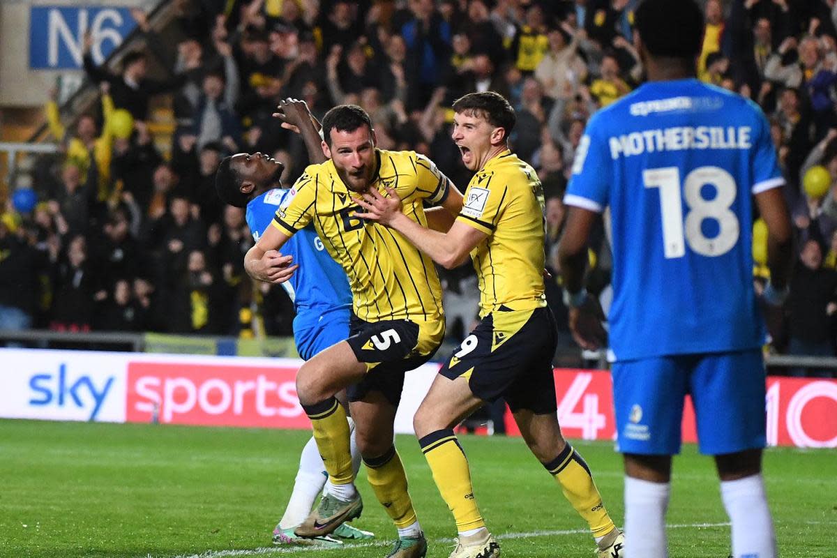 Elliott Moore celebrates his goal against Peterborough United in the play-off semi-final first leg <i>(Image: Mike Allen)</i>