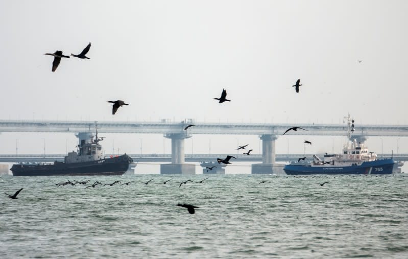 Seized Ukrainian naval ships are towed by Russia's Coast Guard vessels out of the port in Kerch