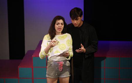 Cast members Barrett Wilbert Weed and Ryan McCartan perform during the rehearsals for "Heathers the Musical" at the Hudson theatre in Los Angeles, California September 17, 2013. REUTERS/Mario Anzuoni
