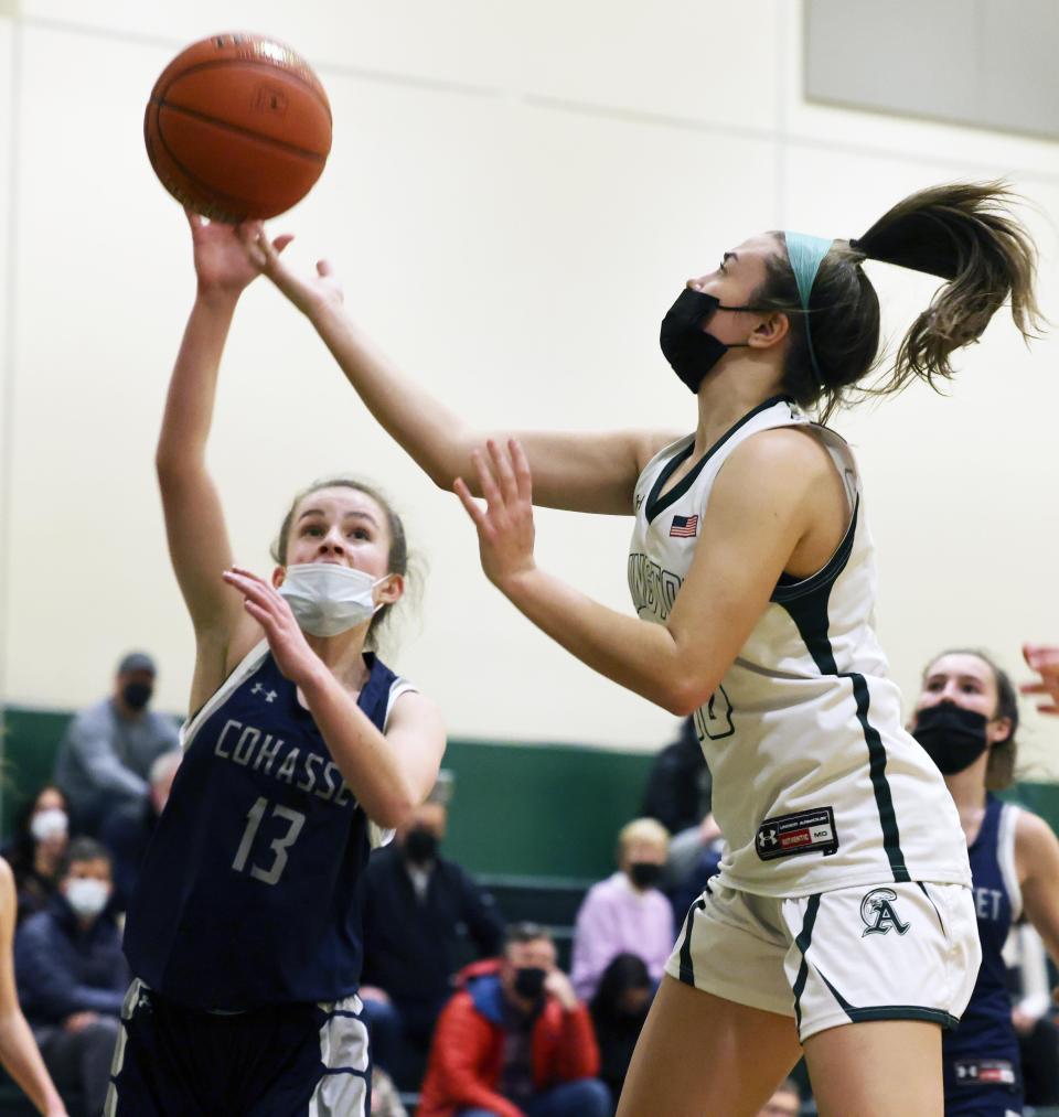 Abington's Ella Williamson drives to the basket for a right-handed layup against Cohasset defender Angelina Grimes during a game on Tuesday, Jan. 4, 2022.