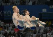 Andrew Capobianco and Michael Hixon of the United States' compete during the men's Synchronized 3m Springboard Final at the Tokyo Aquatics Centre at the 2020 Summer Olympics, Wednesday, July 28, 2021, in Tokyo, Japan. (AP Photo/Dmitri Lovetsky)