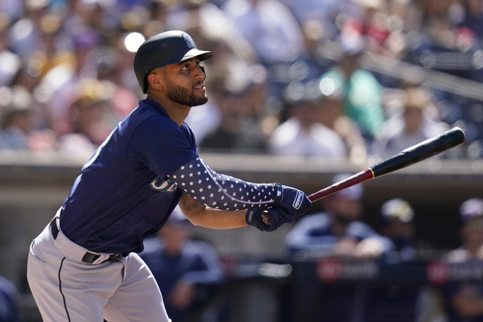 Seattle Mariners' Abraham Toro watches his RBI-double during the first inning of a baseball game against the San Diego Padres, Monday, July 4, 2022, in San Diego. (AP Photo/Gregory Bull)