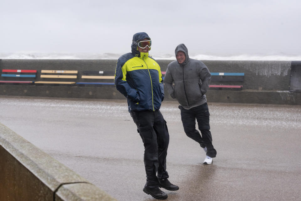 LIVERPOOL, MERSEYSIDE, UNITED KINGDOM - 2022/02/18: People struggle to stay on their feet as high winds send waves crashing over the sea wall at New Brighton promenade during the Storm Eunice.
A red alert (severe weather) has been declared. (Photo by Dave Rushen/SOPA Images/LightRocket via Getty Images)