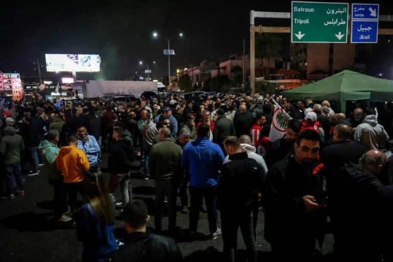 Supporters of the Lebanese Forces block the main Byblos-Beirut highway in protest at the abduction and killing of the Christian party's coordinator for the Byblos area (JOSEPH EID)