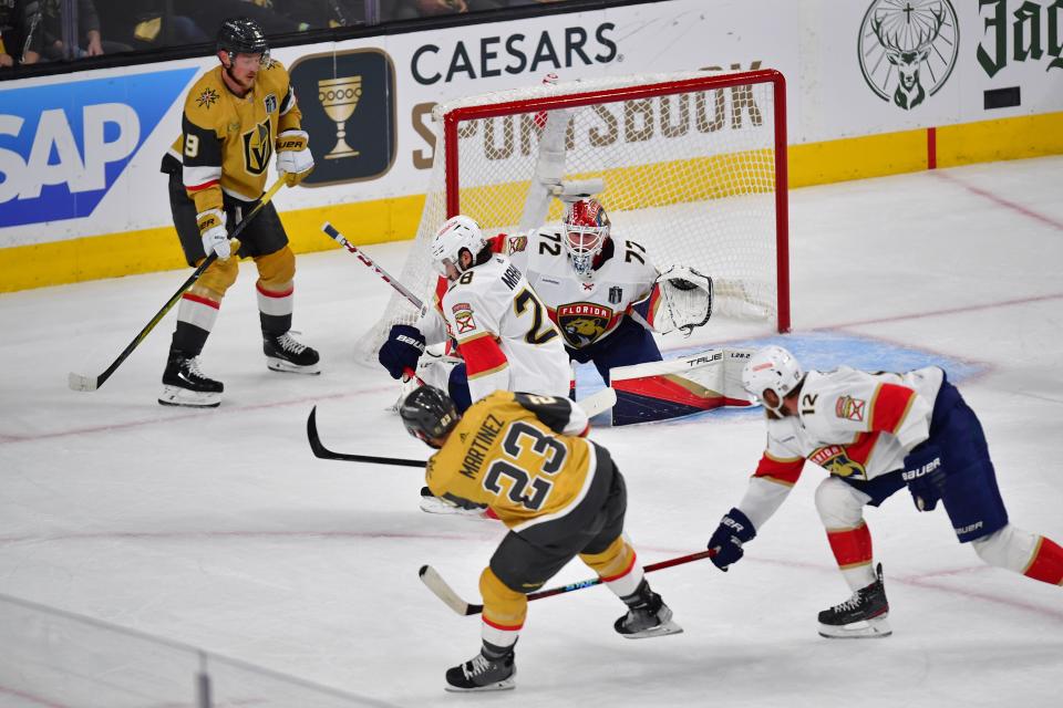 Golden Knights defenseman Alec Martinez (23) scores a goal in the first period against the Florida Panthers.