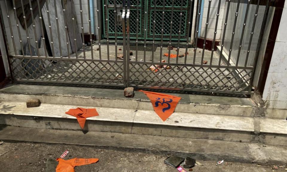 Saffron flags lie outside a mosque a day after communal clashes in Jahangirpuri, Delhi.