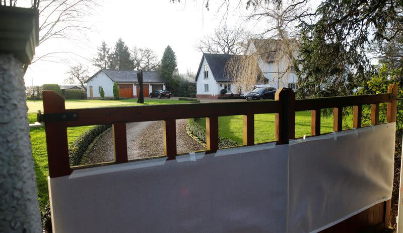 Sheets hide damage to the front gates of the home of Manchester United executive vice-chairman after it was vandalised overnight in Lower Peover, Britain