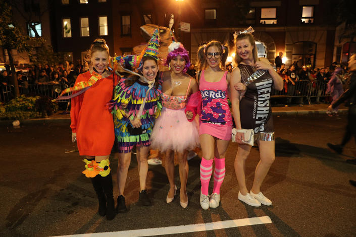 Revelers dressed as candy pose for a photo march in the Halloween Parade in the New York City. (Photo: Gordon Donovan/Yahoo News)