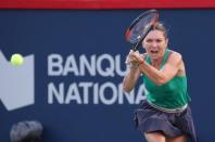 Aug 10, 2018; Montreal, Quebec, Canada; Simona Halep of Romania hits a shot against Caroline Garcia of France (not pictured) during the Rogers Cup tennis tournament at Stade IGA. Mandatory Credit: Jean-Yves Ahern-USA TODAY Sports