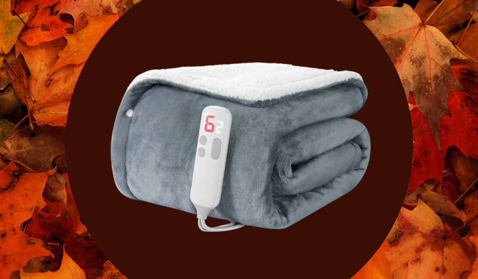 folded gray and white heated blanket with cord and remote