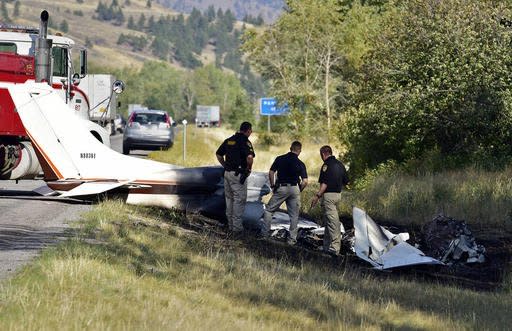 Missoula County sheriff's deputies look at the wreckage of a Cessna 182 that crashed on the shoulder of Interstate 90 near Rock Creekont., on Sunday, Aug. 28, 2016. The crash killed 52-year-old Darrell Ward of Deer Lodge, a star of the History channel series