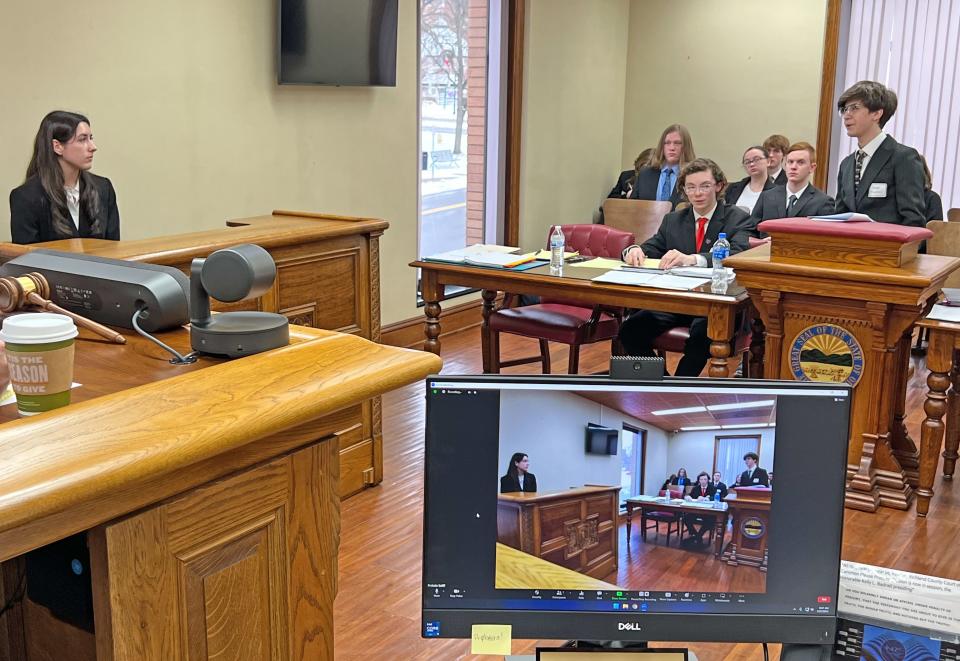 Kaya Thierlein questions Natalie Badnell, both of Lexington High School, during a mock trial Friday in a probate courtroom at the Richland County Courthouse.