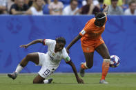 Netherlands' Lineth Beerensteyn, right, escapes United States' Crystal Dunn during the Women's World Cup final soccer match between US and The Netherlands at the Stade de Lyon in Decines, outside Lyon, France, Sunday, July 7, 2019. (AP Photo/Claude Paris)