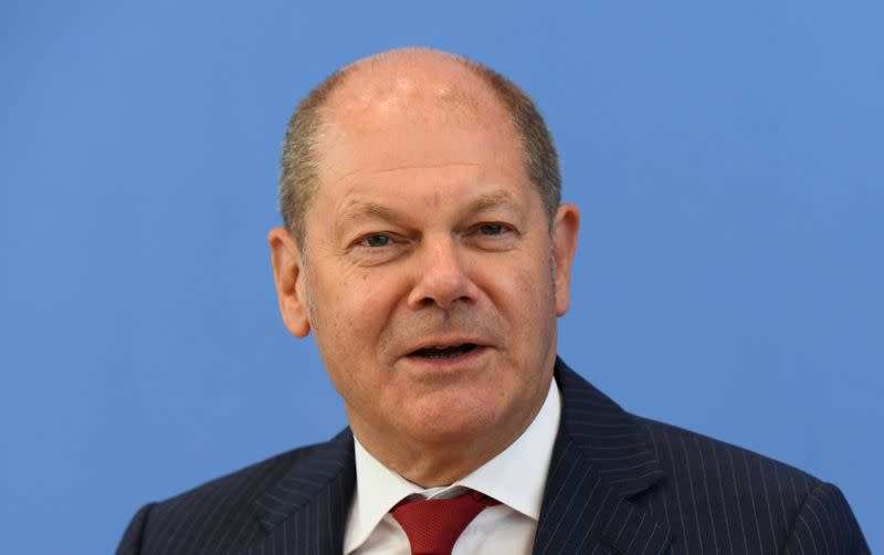 FILE PHOTO: German Finance Minister Olaf Scholz attends a news conference in Berlin
